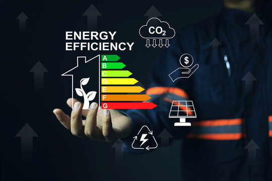Staff or auditor working with home's energy efficiency rating label, which reflects the energy efficiency of residential home and the decision to buy it as a value. Environment house ISO audit staff