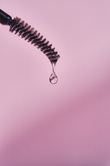 Cosmetic oil for the growth of eyebrows and eyelashes with a brush.
