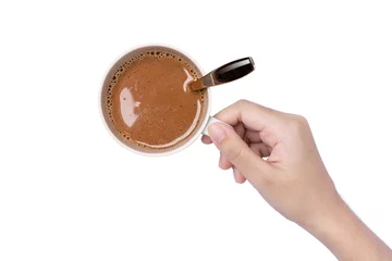 Abwaschbare Fototapete Hand hold ceramic cup of hot chocolate cocoa drink isolated on white background. Top view. Flat lay.  © NIKCOA
