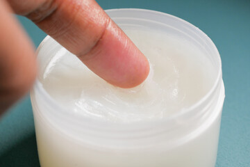 Close up of man hand using petroleum jelly