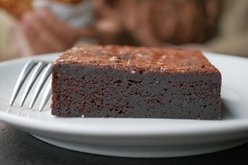 slice of brownie on plate on table 