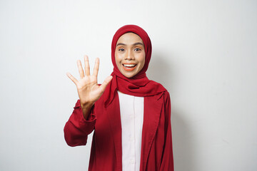 Asian Muslim businesswoman in red casually pointing five fingers isolated on white background