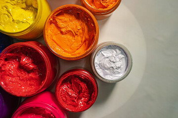 .Top view Collection of colorful smooth gradient background for print fabric and tee shirt. graphic design. .various colors for shirt printing packed in glass bottles lined up.colorful background..