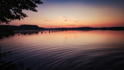See im Abendrot - Sunset - Landscape - Beautiful Sunset scene over the lake and silhouette hills in...