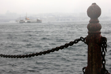 rusty metal railing by the sea