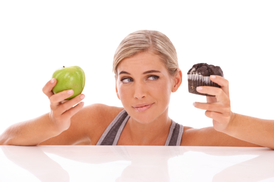 Cupcake, apple and woman thinking isolated and transparent png background for lunch or diet choice. Person or model with vegan or nutritionist decision and confused for healthy food, fruit or dessert