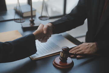 Male lawyer working with contract papers and wooden gavel on tabel in courtroom. justice and law ,attorney, court judge, concept.