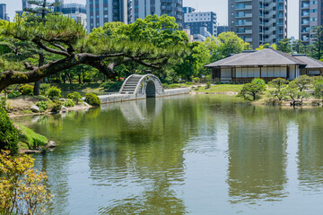Concrete bridge across lake at Shukkeien Gardens in Hiroshima.