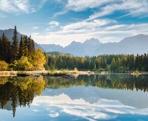 A gorgeous view of Lake Strbske pleso, surrounded by majestic mountains. National Park High Tatra, Slovakia, Europe.