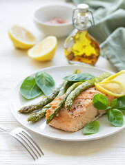 Baked Delicious salmon, green asparagus on  plate