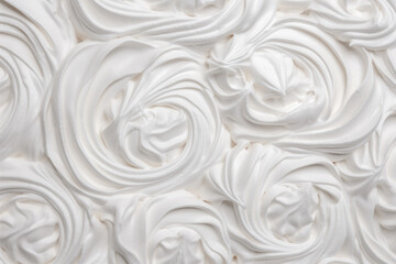 A delightful background featuring luscious swirls of whipped cream, adding a touch of sweetness and elegance to any design or culinary project.