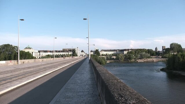 Wilson bridge in Tours, France with e-scooter passing. No vehicle bridge, only electric train, scooter or pedestrians and bicycles.