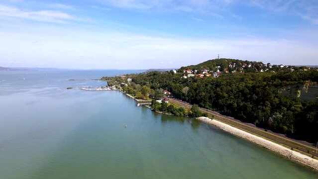 Rising aerial view of Fonyod, Hungary on shore of Lake Balaton.