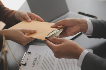 Business and lawyers discussing contract papers with brass scale on desk in office. Law, legal...