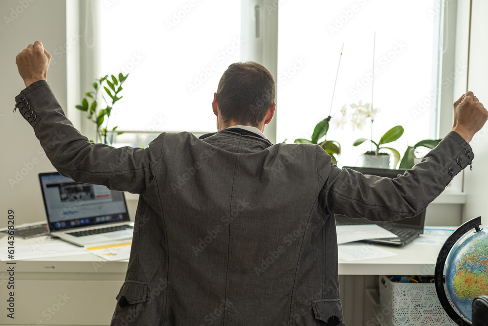 Aufkleber trading stocks online. back view of young businessman or trader working with graph and charts on com