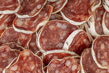 Homemade salami, chorizo and other cured sausages. Dried sausages cut into thin slices