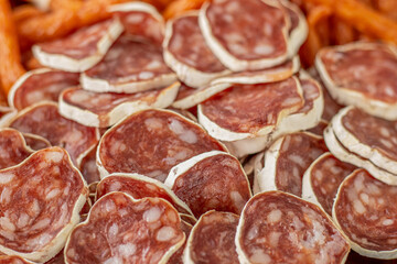 Homemade salami, chorizo and other cured sausages. Dried sausages cut into thin slices