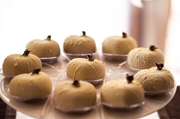 Cakes on a plate at the buffet table during the wedding