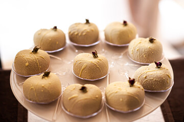 Cakes on a plate at the buffet table during the wedding