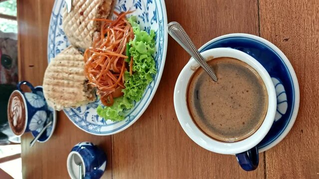 Eating carrot salad vegan panini and carrot salad for breakfast, clean living and sustainable lifestyle 