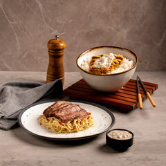 A Portion of Pasta with Beef Slices and Katsu Rice Bowl
