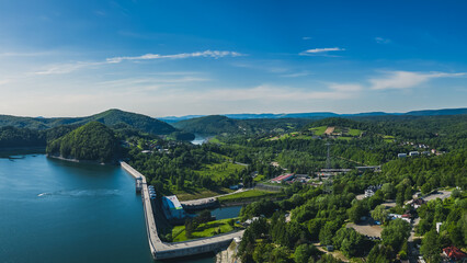 Panoramic view from the drone during sunset, on Lake Solina overlooking the modern gondola lift with a lookout tower over the Solina water dam, in the Polish Bieszczady Mountains, Poland © Daniel