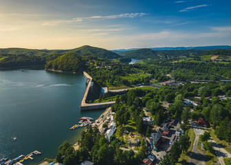 Panoramic view from the drone during sunset, on Lake Solina overlooking the modern gondola lift with a lookout tower over the Solina water dam, in the Polish Bieszczady Mountains, Poland © Daniel