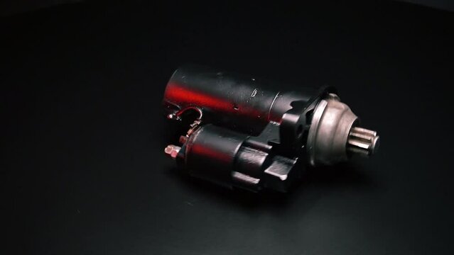 old black starter for starting the engine in a car after repair
