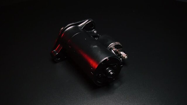 old black starter for starting the engine in a car after repair