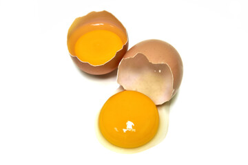 Eggs. Fresh chicken, brown and egg yolks.  Isolated on white background. Top view photo.