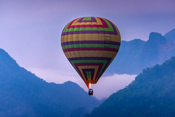 Hot air Balloon float over Misty Mountain in Vang Vieng, Laos