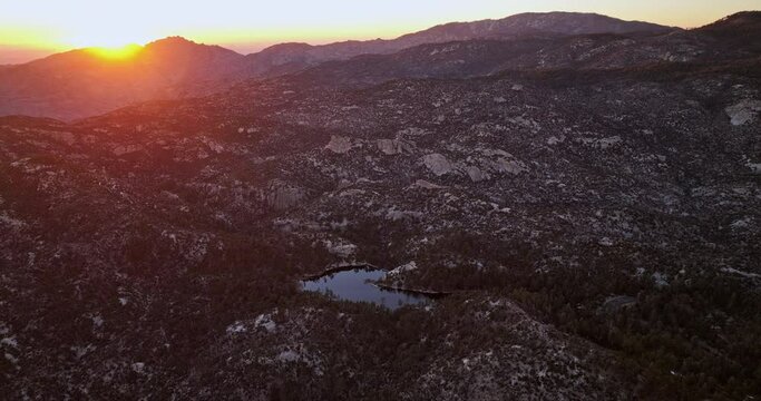 Willow Canyon Arizona Aerial v2 panoramic panning view drone flyover mountain capturing rocky hillside landscape and springs lake at sunset golden hours - Shot with Mavic 3 Cine - March 2022