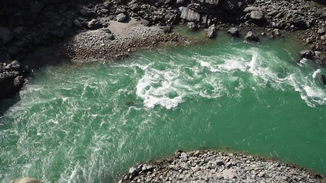 Aerial shot of Alaknanda River flowing between Srinagar and Rudraprayag in the Garhwal Region of Uttarakhand, India.