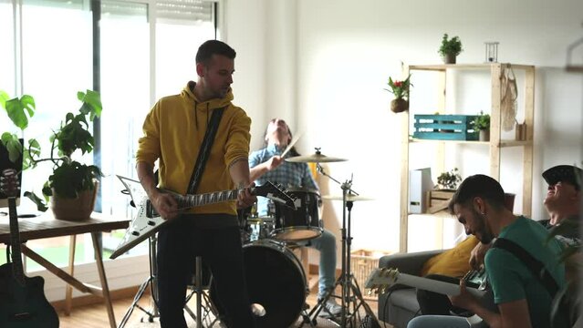 music band rehearsing in the studio with electric instruments