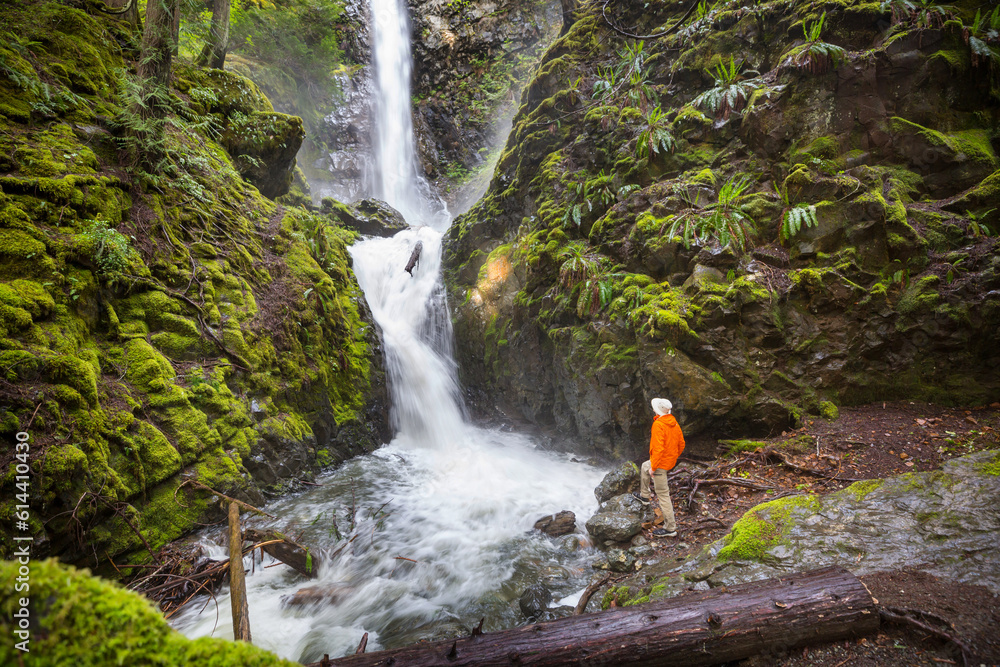 Sticker hiker near waterfall