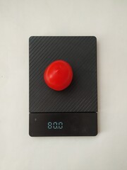 tomato on scales, diet concept, proper nutrient 