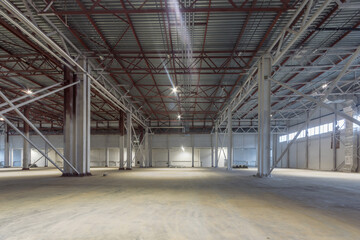 Spacious modern empty warehouse.  Warehouse premises with final finishing. Metal bearing structures.