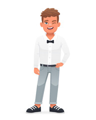 A beautiful cute happy schoolboy child in a white shirt with a bow tie. A smiling little boy.