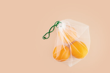 eco friendly Reusable bag with oranges on a natural background