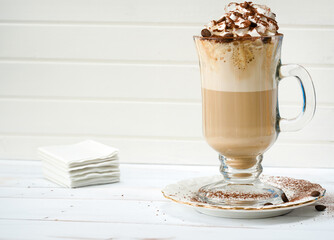 Irish coffee with whipped cream and cocoa