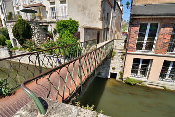 Fototapeta na wymiar France, Montargis. Cityscape with a canal. May 29, 2023.