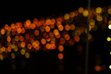 Golden stars shine with special light on a black background.  golden sparkles.