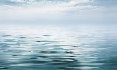  a large body of water with clouds in the sky and water waves on the surface of the water and the water surface is blue and there is also a few ripples on the water.  generative ai