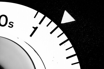 monochrome close-up of an old analog laboratory timer set to two