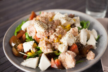 Closeup of salad with fish and vegetables for lunch