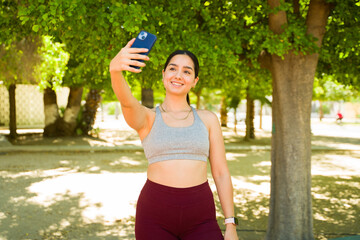 Attractive latin woman taking a selfie after exercising or running