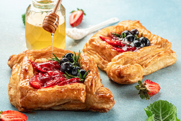 Puff pastry with strawberries, blueberries. Restaurant menu, dieting, cookbook recipe top view