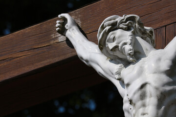 Jesus on the cross. Christian sculpture.