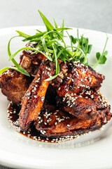 chicken wings with pepper sauce. vertical image. top view. place for text