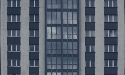 Gray windows of an apartment building. Abstract urban background.